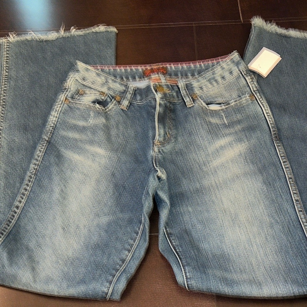 Eddie Rodriguez Woman's Denim Jeans Dark Size 0 Flare raw hem jeans.
